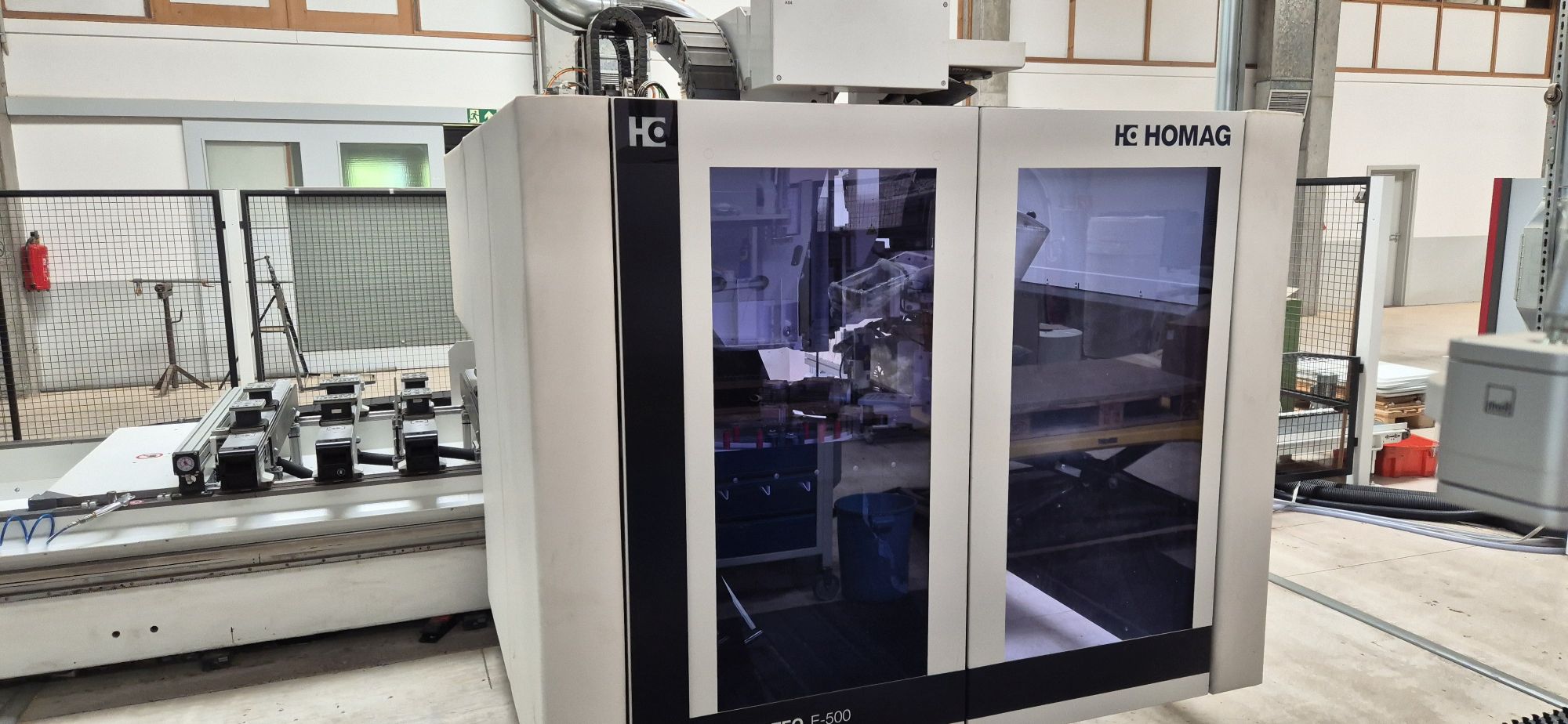CNC machining centre with gluing unit / HOMAG / CENTATEQ E-500